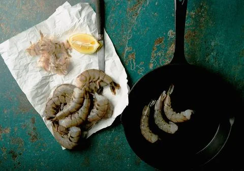 Raw shrimps on the dark rustic background Stock Photos