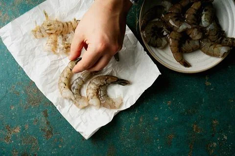 Raw shrimps on the dark rustic background Stock Photos