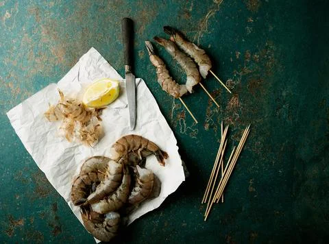 Raw shrimps on the dark rustic background Stock Photos