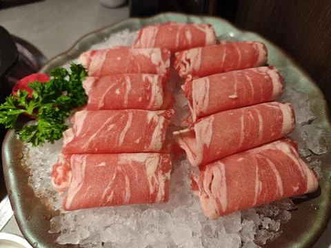 Raw slice of beef meat on the ice ready for cooking Stock Photos