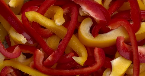 Raw sliced yellow and red peppers background texture. Stock Footage 297900544