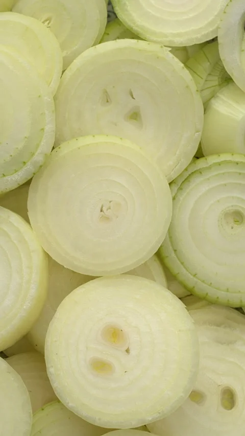 Raw sliced yellow onion background. Vertical video. Stock Footage 301306475