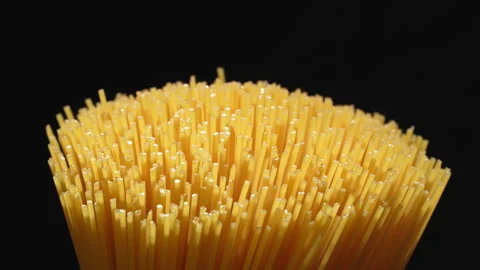 Raw Spaghetti Bundle Tips on Black Background Video stock 345775257