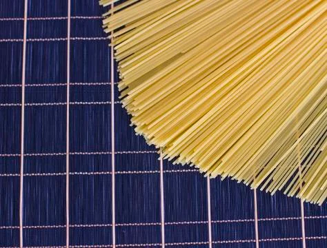 Raw spaghetti on a checkered dark table Stock Photos
