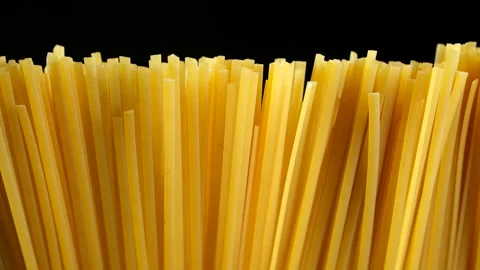 Raw spaghetti isolated on black background Stock Footage 237373592