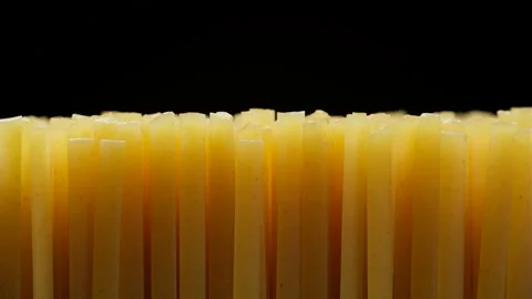 Raw spaghetti isolated on black background, slider shot Stock Footage 239619058