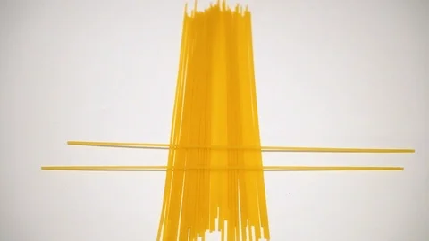 Raw spaghetti on white background. 2 Video stock 98154603