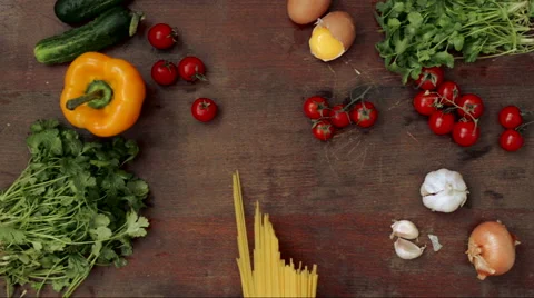 Raw spaghetti on wooden table Stock Footage 62063937