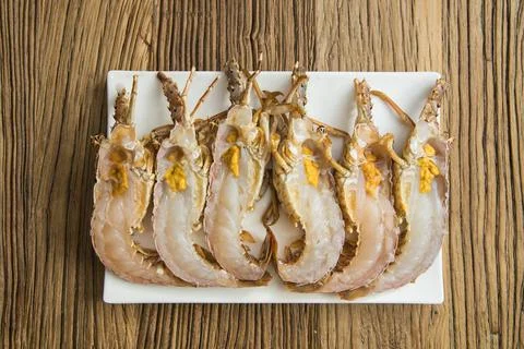 Raw split mantis shrimp arranged on plate Stock Photos