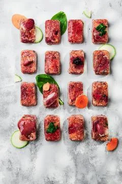 Raw square cutlets on a white background Stock Photos