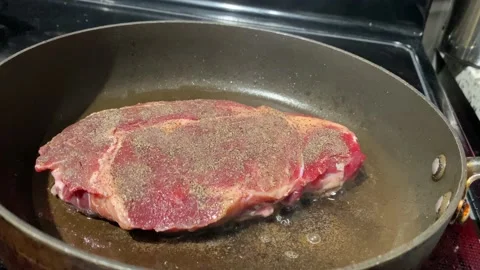 Raw Steak on a Burner Stock Footage 151761862