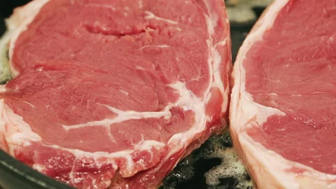 Raw Steak Cooking on Pan Stock Footage 151029386