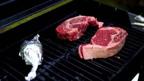 Raw Steak on the Grill Stock Photos