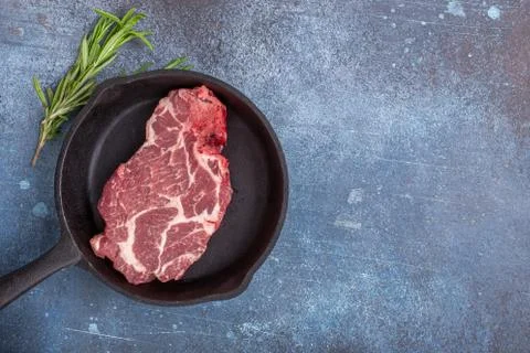 Raw steak on pan with space Fotos de archivo