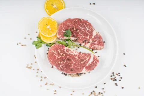 Raw steak on a plate Stock Photos