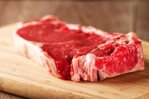 Raw Steak ready to be grilled. High quality photo. Stock Photos