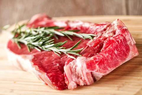 Raw Steak ready to be grilled. High quality photo. Stock Photos