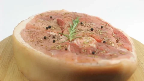 Raw Steak with Spices and Rosemary Rotating Stock Footage 88409187