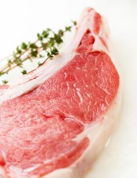 Raw steak on a white cutting board Stock Photos