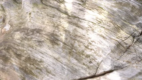 Raw stone texture. Sun glare on a stone wall. Video stock 156994101