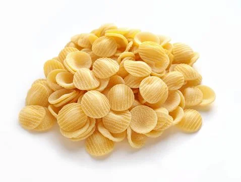 Raw striped shell pasta on white background Stock Photos