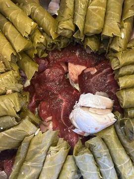 Raw Stuffed Grape Leaves with Meat in Pot Stock Photos