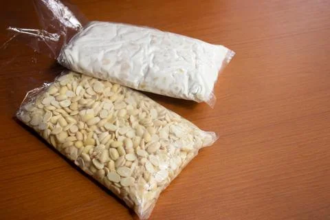 Raw tempeh and raw soybeans. Stock Photos