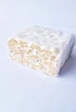 Raw tempeh wrapped in plastic 스톡 사진
