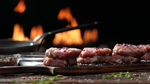 Raw tenderloin steak meat beef sprinkled with salt and seasoning Stock Footage 170351412