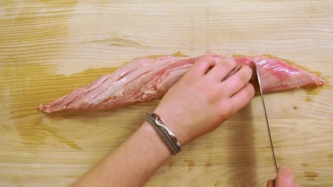 Raw tenderloin steak on the wood desk Stock Footage
