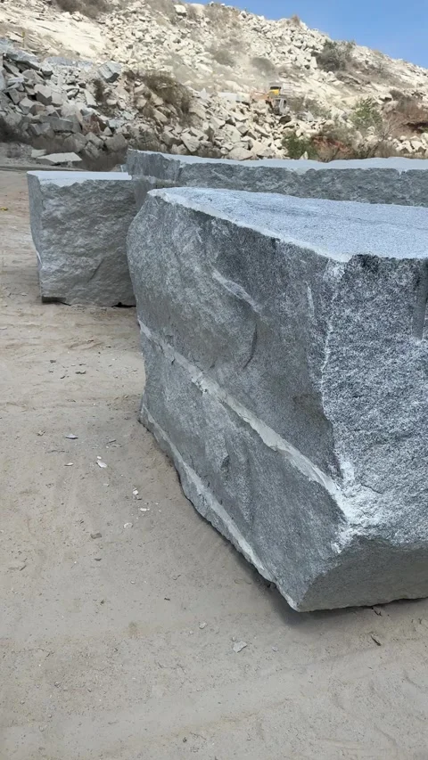 Raw texture of granite rock face with visible drill marks n mineral layers .. Stock Footage 334171217