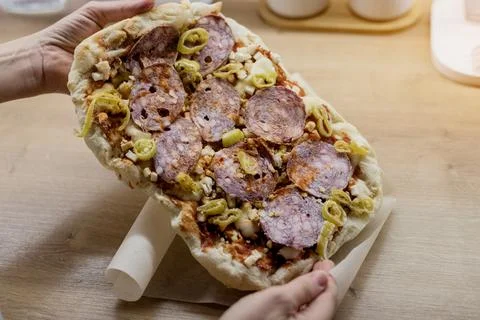 Raw thin crust pinsa with pepperoni Photos