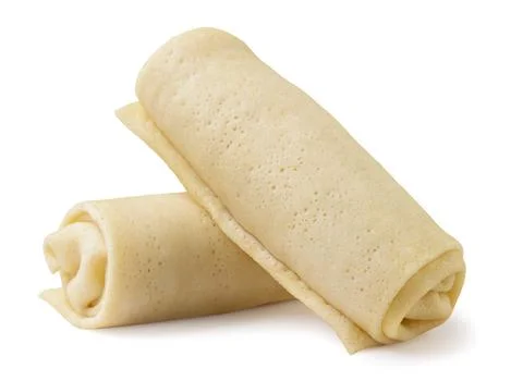 Raw thin pancakes with stuffing on a white background. isolated Stock Photos