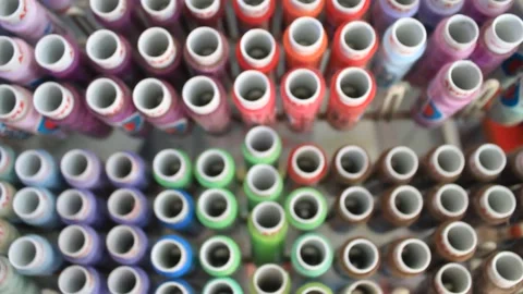 Raw of thread on shoppe display of using material for sewer dressmaker Stock Footage 197148725