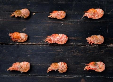 Raw Tiger shrimps on black board. Stock Photos