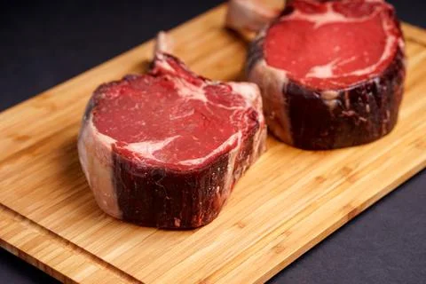 Raw Tomahawk Steak Stock Photos