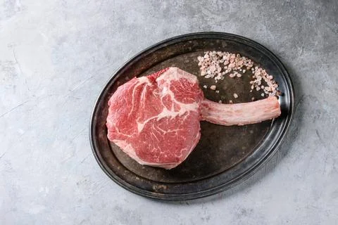 Raw tomahawk steak Stock Photos