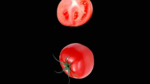 Raw tomatoes falling in slow motion on black background Stock Footage 194981378