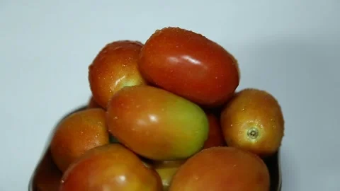 Raw tomatoes rotating Stock Footage 153429035