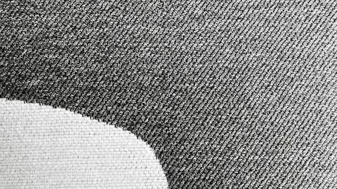 Raw torn denim macro texture exposes jagged rip revealing stark woven fabric  Stock Photos