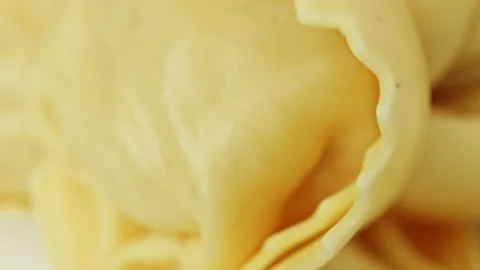 Raw Tortellini pasta parcels macro close up presentation slowly rotating st.. Stock Footage 344692662