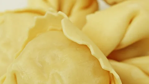 Raw Tortellini pasta parcels macro close up presentation slowly rotating st.. Stock Footage 344692964