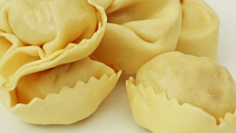 Raw Tortellini pasta parcels macro close up presentation slowly rotating st.. Stock Footage 344693460