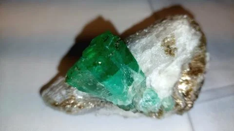 Raw Translucent Green Emerald Crystal Specimen On White Quartz Rock Stock Photos