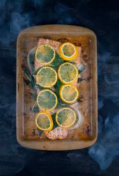Raw trout in baking dish Stock Photos