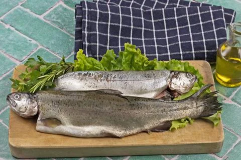 Raw trout on a cutting board Stock Photos