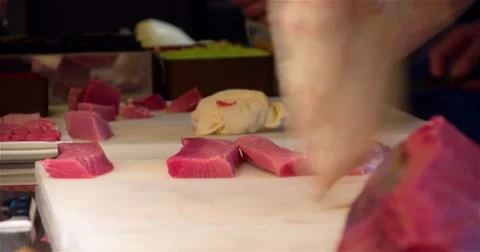 Raw tuna fish filet sushi restaurant kitchen 4k video: chefs cook preparing Stock Footage 67487739