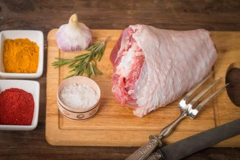 Raw turkey thigh with spices Stock Photos