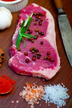 Raw uncooked ribeye beef steak butcher selection Stock Photos