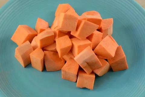 Raw uncooked yam cubes Stock Photos